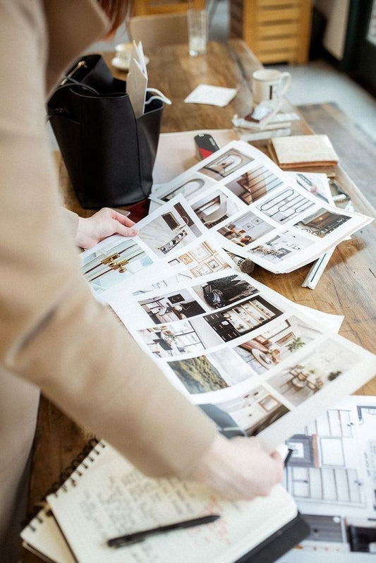 Person working with design materials on a table